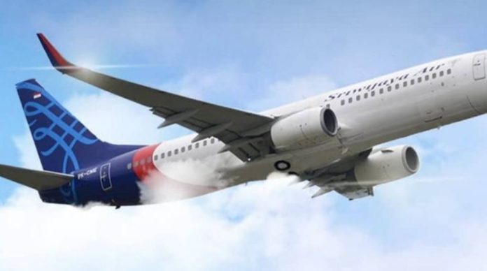 Debris, body parts found at Indonesia plane crash site
