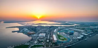 Miral and Etihad Rail plan Yas Island shuttle connections Aerial view of Yas Island and its waterfront at sunset.