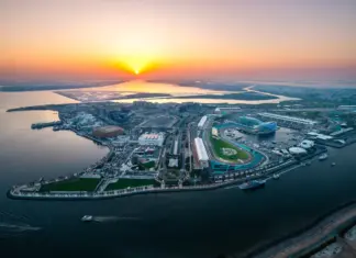 Miral and Etihad Rail plan Yas Island shuttle connections Aerial view of Yas Island and its waterfront at sunset.