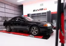 Nissan opens first overseas NISMO Performance Centre in Melbourne Black Nissan GT-R inside a NISMO-branded workshop.