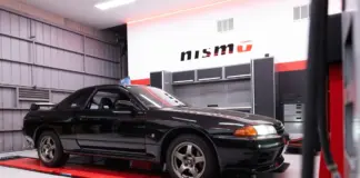 Nissan opens first overseas NISMO Performance Centre in Melbourne Black Nissan GT-R inside a NISMO-branded workshop.